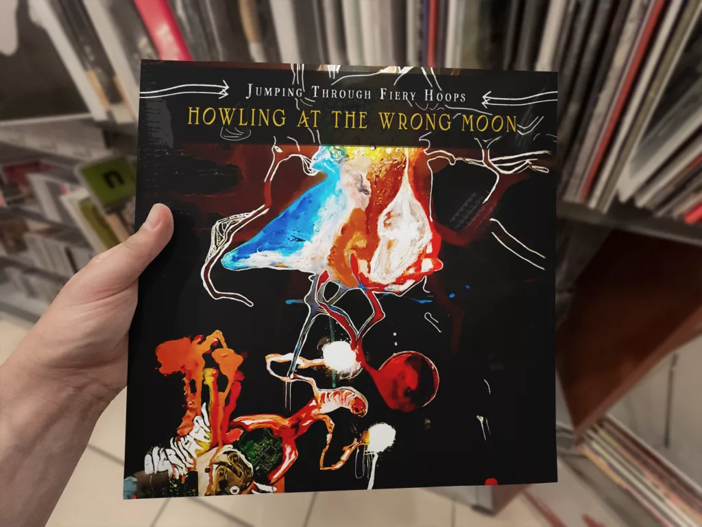 Album Cover Mock-up as vinyl hold in a hand  Jumping Through Fiery Hoops.
