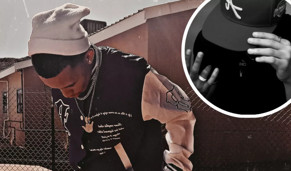 Youngboi OG poses in streetwear style, highlighting his new single 'Naruto (Blue Bird) Freestyle.'